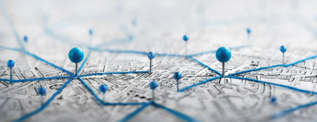 Find your way. Location marking with a pin on a map with routes.