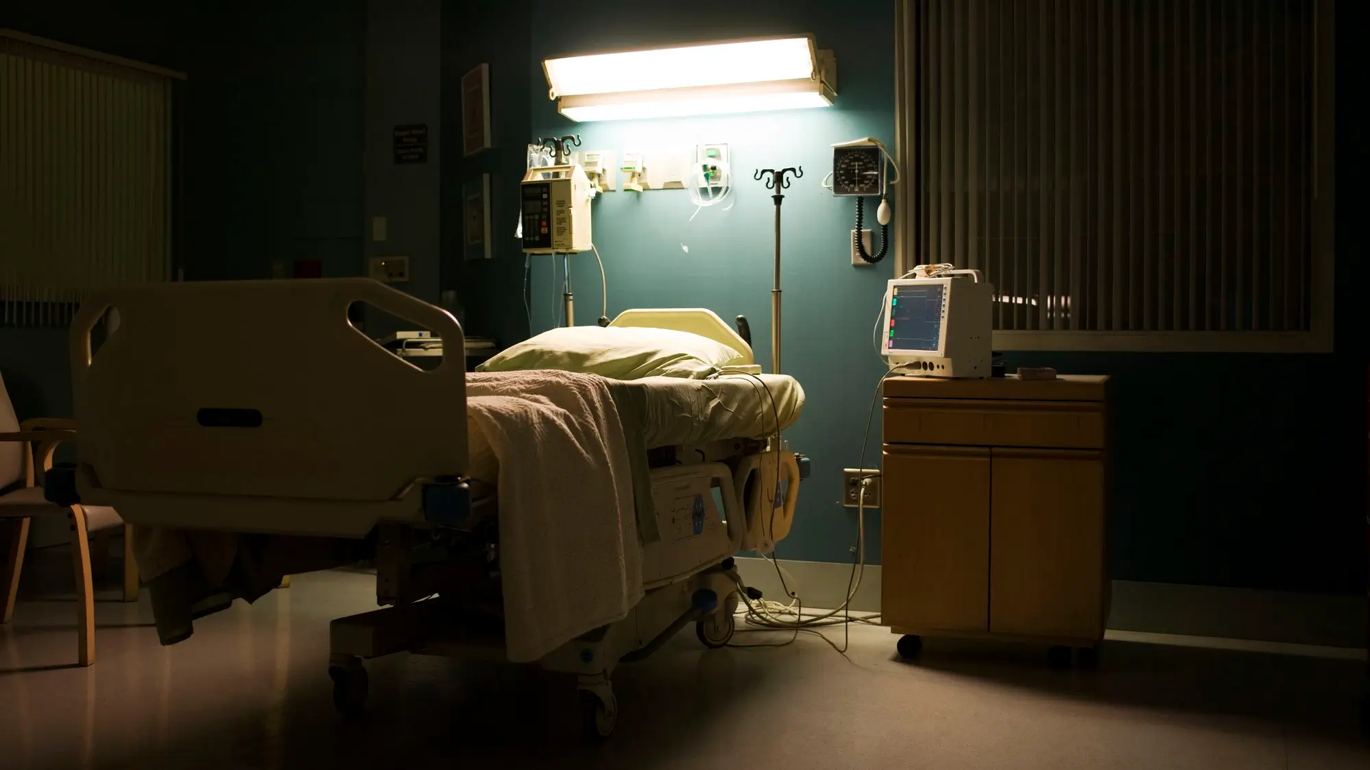 Hospital room with bed, monitors and life monitoring equipment