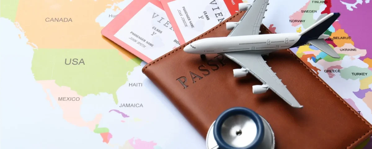 airplane, passport, stethoscope, world map