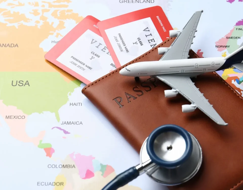 airplane, passport, stethoscope, world map