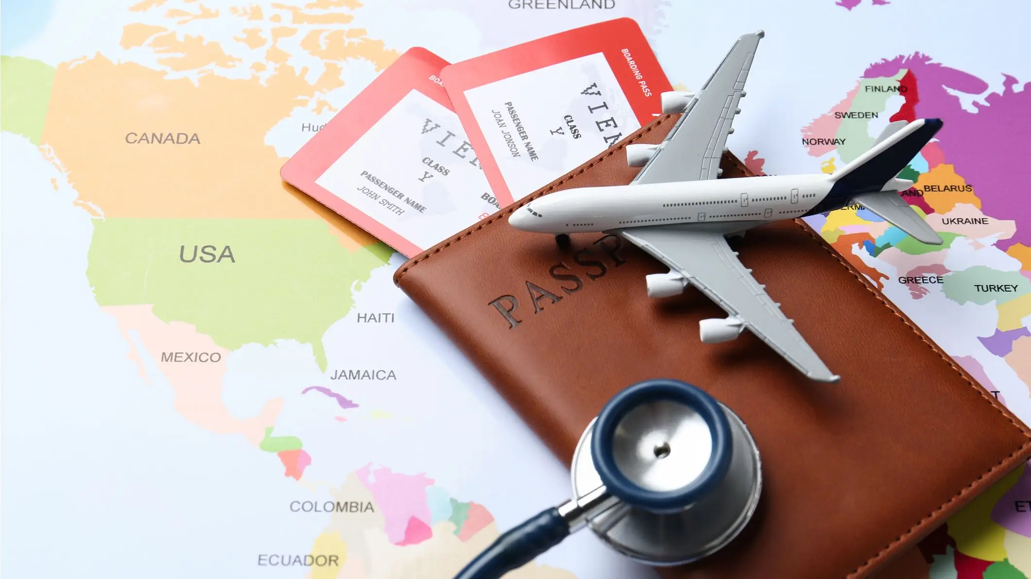 airplane, passport, stethoscope, world map